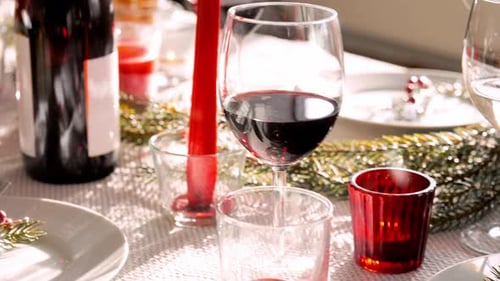Festive Christmas Table Setting with Wine and Treats