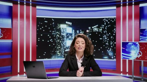 Female Anchor Delivers News in Modern Studio