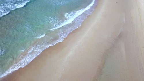 Beautiful empty beach with small waves - Aerial footage.
