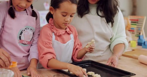 Children and Adult Preparing Cookies in Kitchen