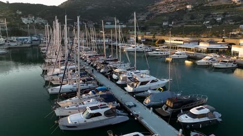 Aerial View Luxury Sailing Boats and Yachts on a Harbour Yacht Port and Golden Sunset The Rays of