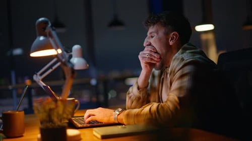 Exhausted Man Working Night Cabinet Closeup Tired Guy Yawning Using Laptop