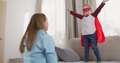 Boy Jumps Into Mother's Arms Dressed as Superhero