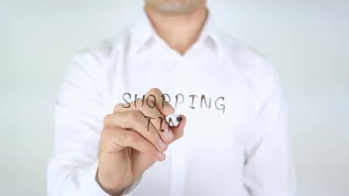 Man Writes Shopping Time with Marker
