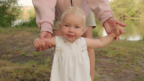 Infant Learning to Walk Outdoors with Adult Support