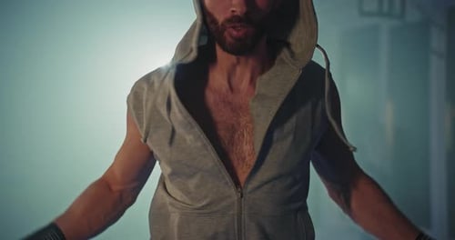 Active Man Jumping Skipping Rope in Sport Club