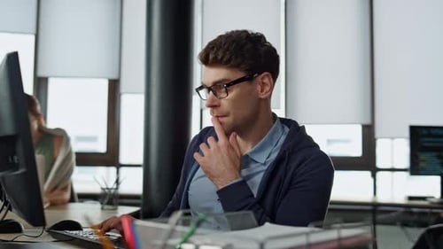 Computer Guy Looking Screen on Office. Thoughtful Engineer Checking Code Problem. Pensive