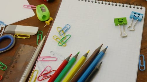 Colorful Stationery and Office Supplies on Wooden Desk