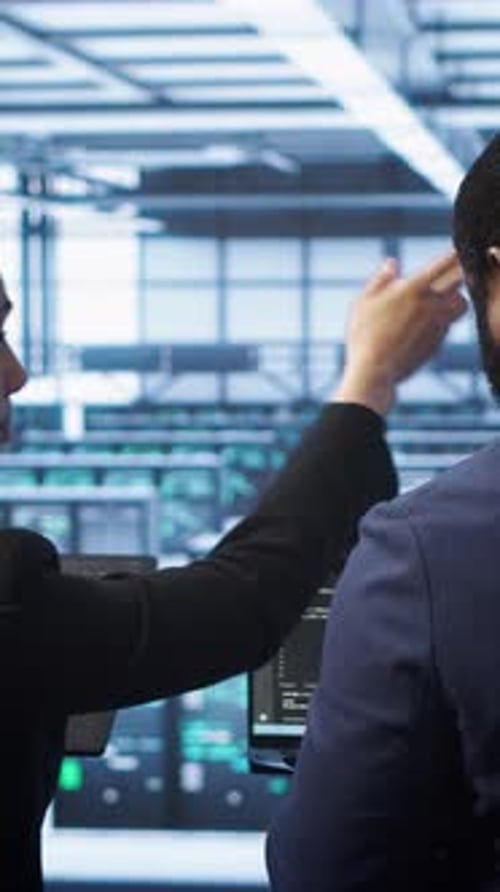 Vertical Video Teamworking Programmers in Data Center Overseeing Server Operations