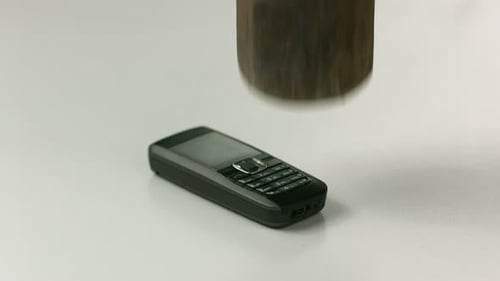 Hitting Cell Phone with Sledge Hammer,