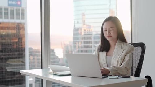 Young Asian Business Woman Manager Working on Laptop in Corporate Office