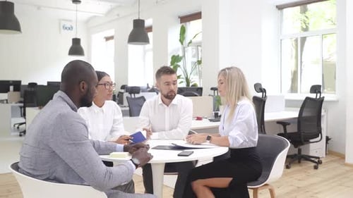 Multiethnic Business People During Meeting in Modern Office
