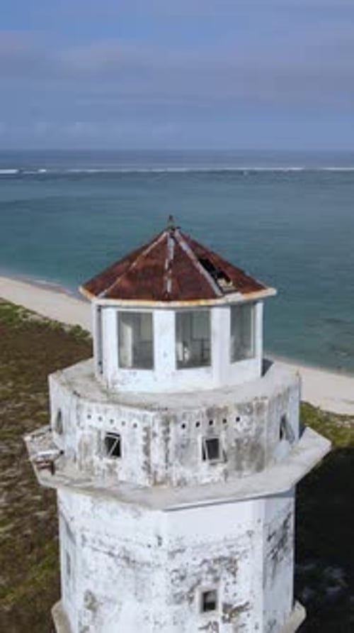 Aerial View of Old Lighthouse at Ocean Coastline