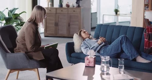 Young Adult Caucasian Woman Lying on Sofa Complaining Family and Selflove Problems Talking to Mental