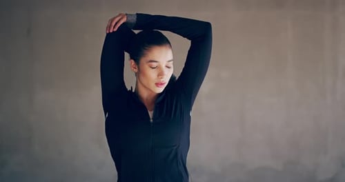 Woman Stretches Arms Before Exercise