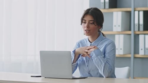 Young Woman Teaching an Online Lesson From Her Home Office