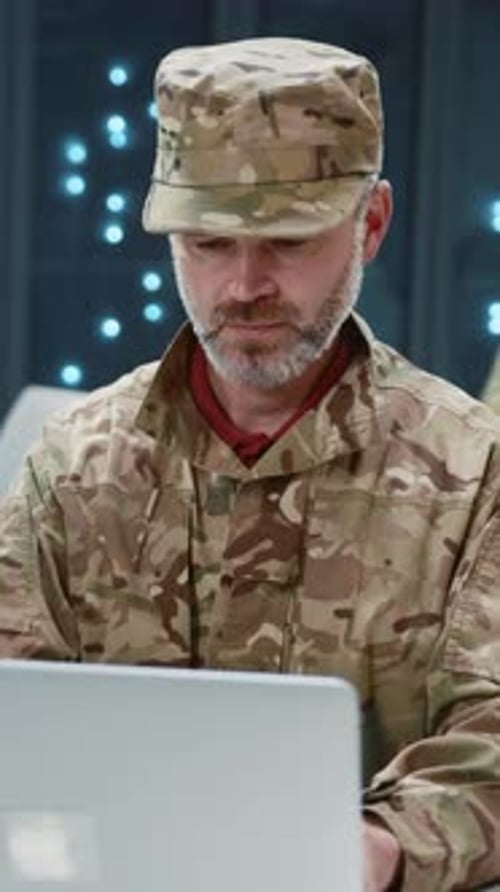 In Data Center Bearded Military Officer Working on National Cyber Security Data Information at