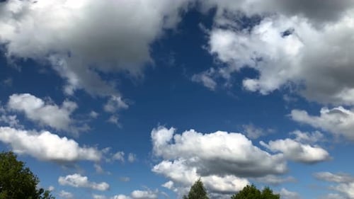 Clouds Float Gently in a Blue Sky