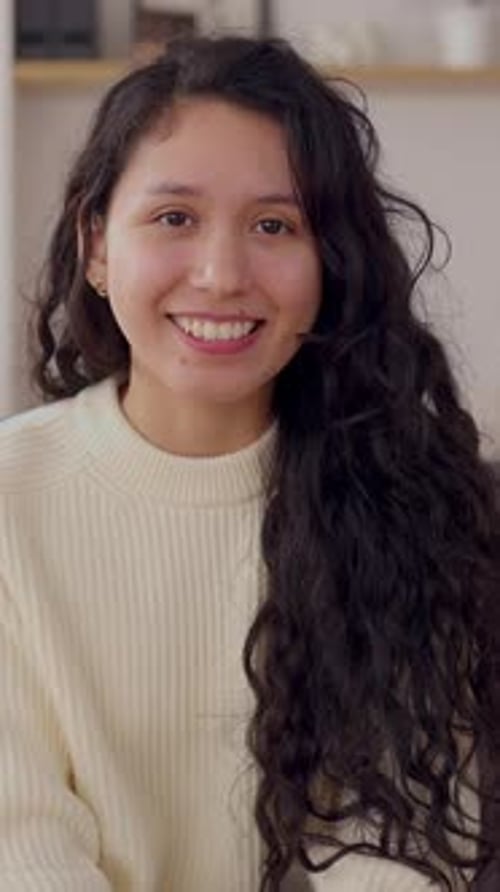 Smiling Young Woman with Wavy Hair Close Up