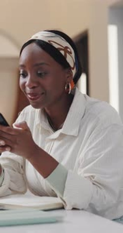 Excited Woman Reacting to News on Her Phone