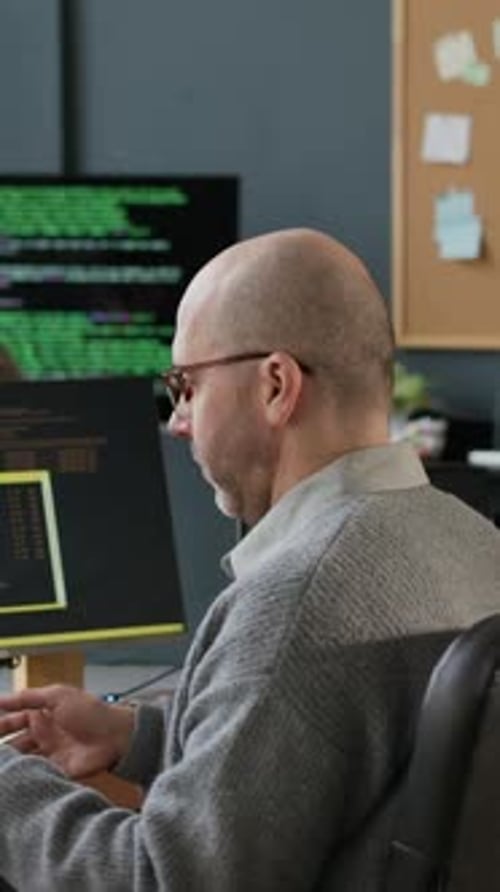 Vertical of Programmers Working in Modern Office