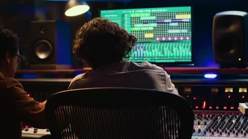 Sound Designer Working with Artist to Create a New Song for His Album