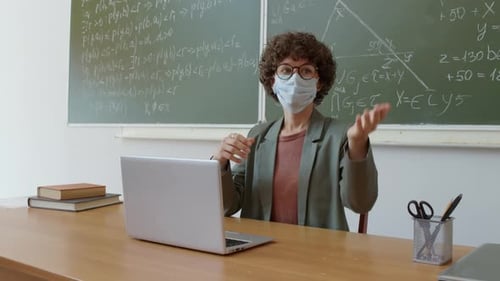 Teacher Giving Online Class in Classroom
