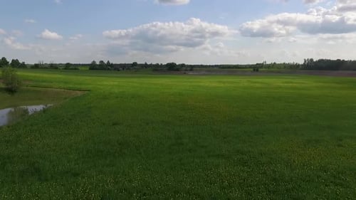 Country side panoramic landscape in summer time from above and ground with hay rolls and roads