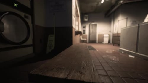 First-Person Perspective Move Through Grungy Dimly Lit Laundromat