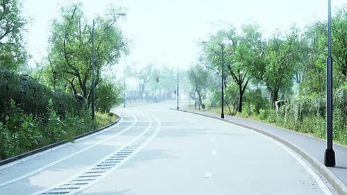 Empty Asphalt Road and Beautiful View of Cityscape on Sunny Day