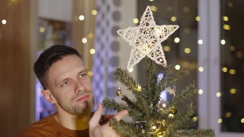 Portrait of Sad Lonely Middle Aged Man Near Christmas Tree