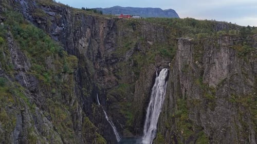Voringfossen seen from sky framed by nature and steep valley walls