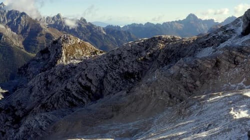 aerial panorama of a valley in the alps mountains covered by snow