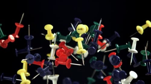 Colorful Push Pins Floating in a Black Background