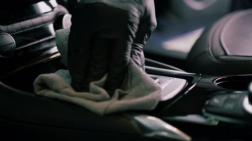 Cleaning Car Interior with Cloth and Glove