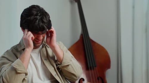 Man Rubbing Temples Due to Headache or Stress