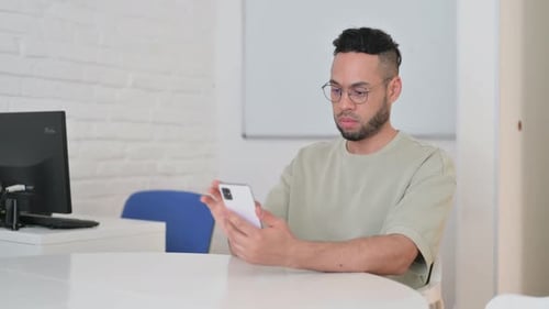 Man Talking on a Smartphone Video Call