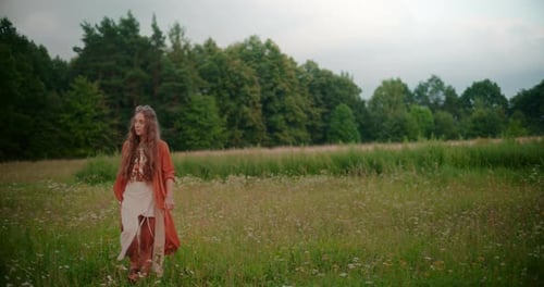 Woman Walking In Front Of A Beautiful Forest And Meadow Looking For Inspiration And Peace