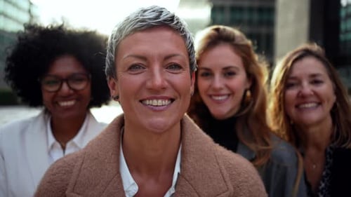 Happy Businesswomen Smiling Together in the City