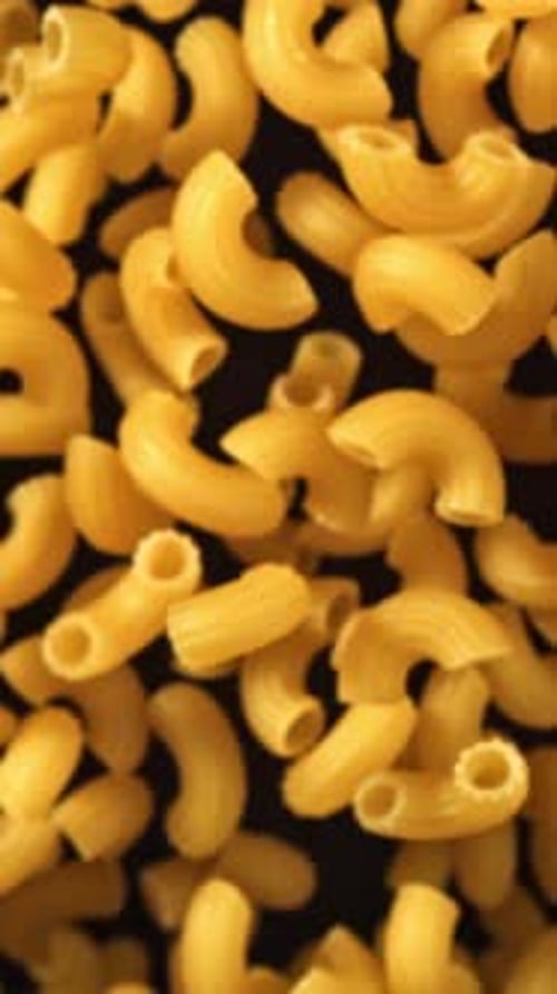 Super Slow Motion Flying Dry Macaroni Pasta Filmed on a Highspeed Camera at 1000 Fps