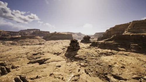Dawn Over Arid Landscape Featuring Ritual Cairn and Soft Lighting