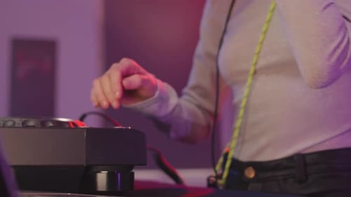 DJ Mixing Music on a Turntable