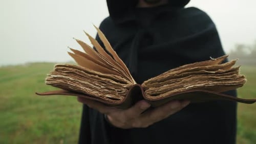 In A Gloomy Winter Park A Man Reads An Aged Holy Book