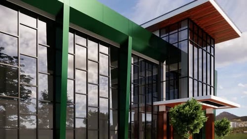 Edificio moderno con detalles en verde y ventanas de cristal.