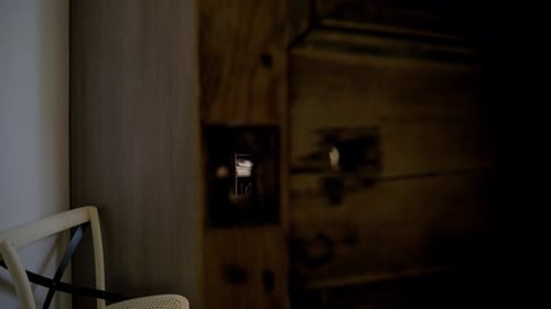 Cozy walk in closet with organized shelves and warm lighting