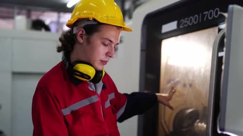 Factory Worker Operating Machine in Modern Plant