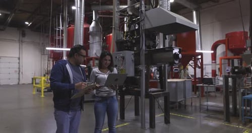 Coffee Roaster Managers Talking Using Laptop in Food Production Plant 10 Seconds or Greater