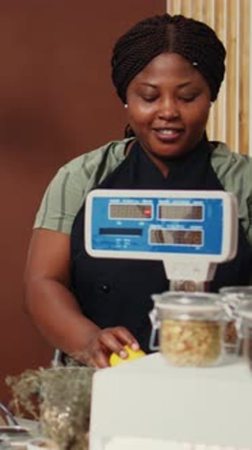 Vertical Video Local Vendor Putting Bio Products on Electronic Scale