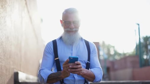 Senior Man Using Smartphone Outdoor