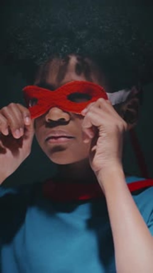 Portrait of Little Superhero in Mask and Cape